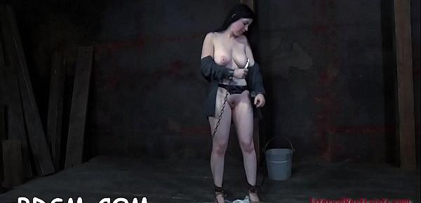  Nude tied up girl is sucking hard toy fake penis hungrily